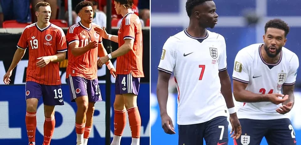 Jugadores de Colombia y Inglaterra conversando en el campo
